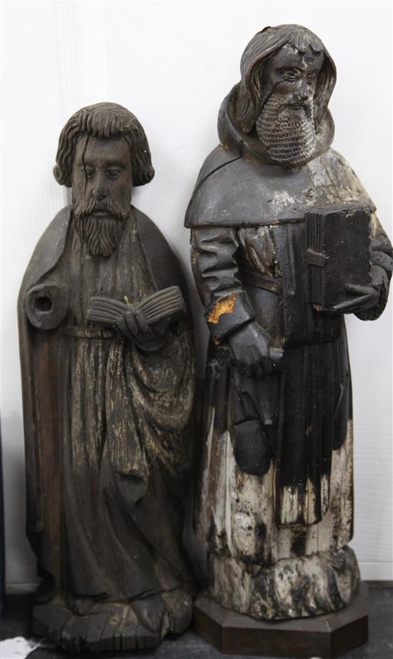 A European carved oak figure of a Saint, largest 22.25in. incl. plinth base